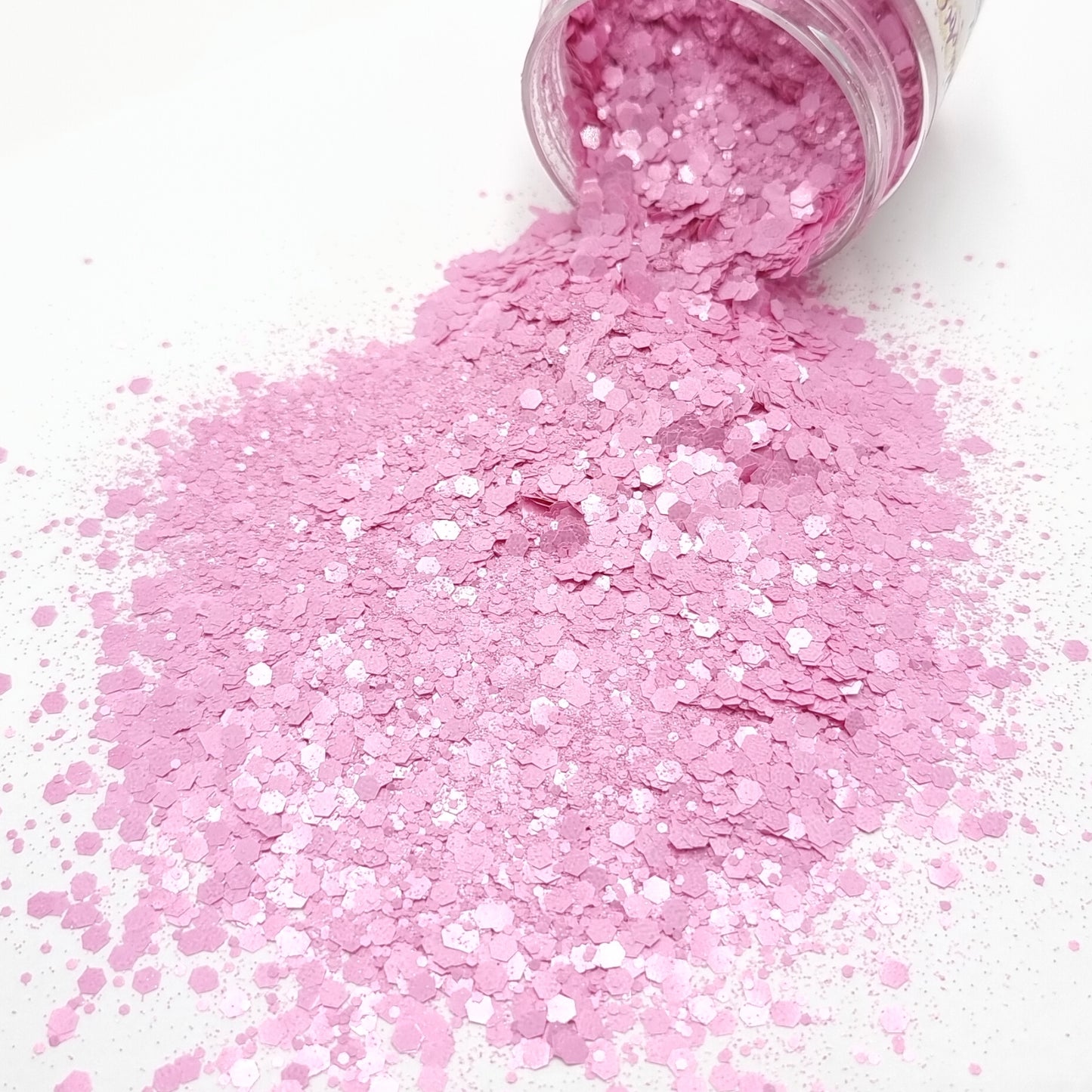 Betty is a pink mixed size hex chunky glitter. 