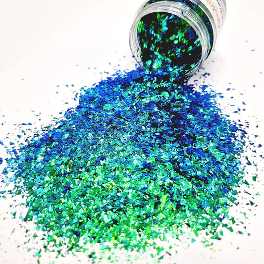 Tropical Water is a colour changing, small size flake glitter. Shifts between blue and green.