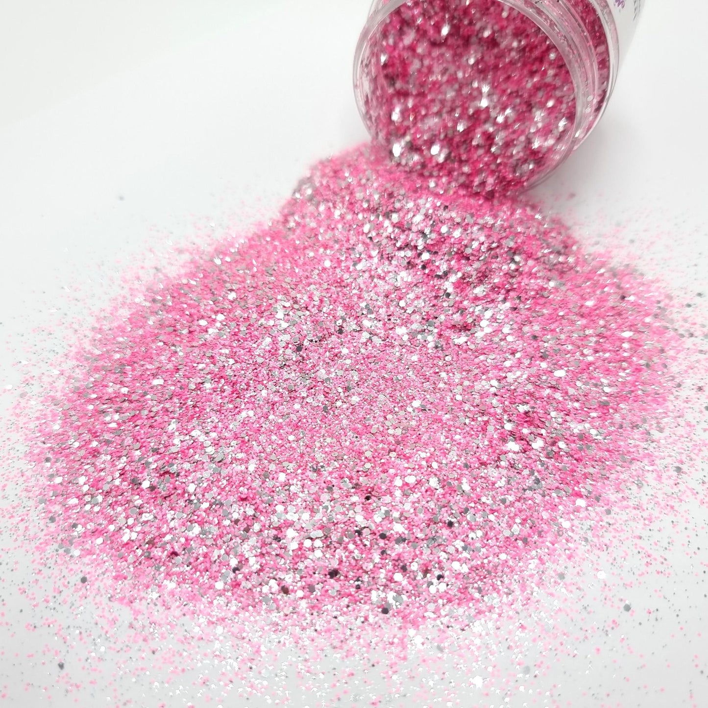 Irresistible is a ultra fine pink and very fine silver glitter.