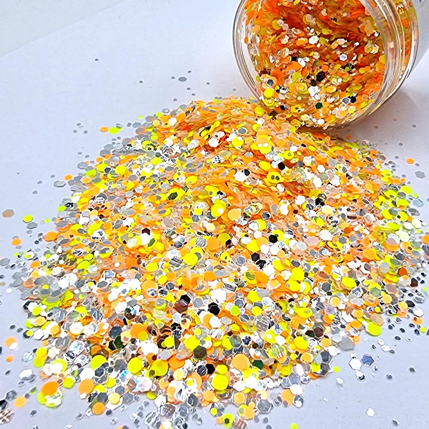 Bee Alive is a bright yellow, orange and silver mixed hex and round shape glitter